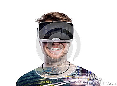 Double exposure. Man wearing virtual reality goggles. Night city Stock Photo