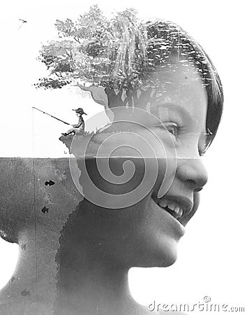Double exposure portrait of a young smiling child combined with a beautiful handmade painting of a fisherman sitting under a tree Stock Photo