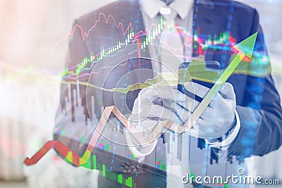 Double exposure of professional businessman connect internet smart phone and stock chart of business centre with international Stock Photo