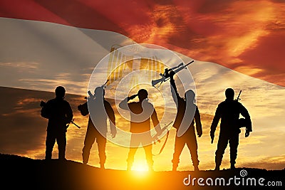 Double exposure of silhouettes of a soliders and the sunset or the sunrise against flag of Egypt. Stock Photo