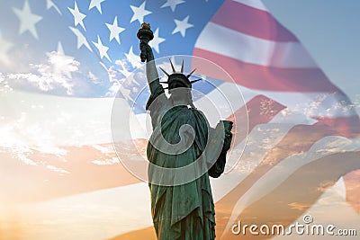 Double exposure with statue of liberty and United States flag blowing in the wind Stock Photo