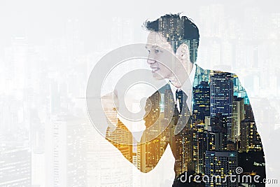 Double exposure of winning businessman against city Stock Photo