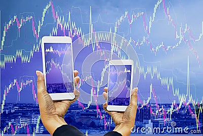 Double exposure Women hand holding smartphone,graph display screen with city landscape background and stock chart,concepts stock Stock Photo