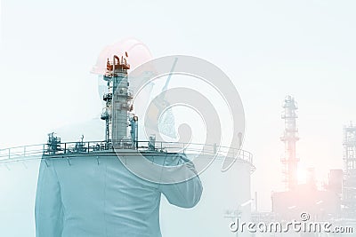 Double exposure workers hand holding walkie talkie, communication in oil refinery plant Stock Photo