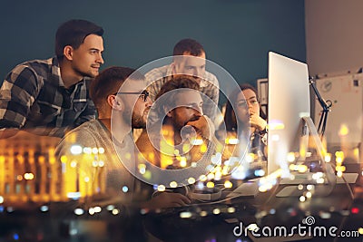 Double exposure of young people working in office and illuminated city at night Stock Photo