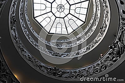 Tourist looking at the double helix Spiral staircase Editorial Stock Photo