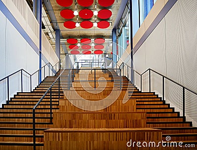 Double internal wooden staircase with metal handrail Stock Photo