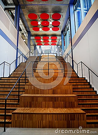 Double internal wooden staircase with metal handrail Stock Photo