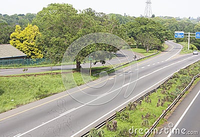 Double Lane Asphalt Highway with Sign Posted Off Ramp Stock Photo