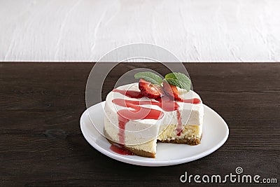 Double layer cheesecake with fresh strawberries and berry syrup Stock Photo