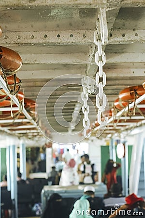 Double line of lifebuoy ring floatation inside a traveler ship . Vertical view blurry background Stock Photo