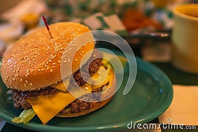 Big classic beef cheese burger. Double meet Burger with melting cheddar cheese. Cheeseburger burger with double cutlet Stock Photo
