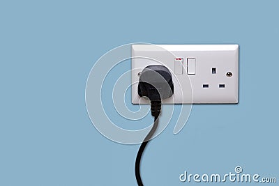 Double power socket and single plug switched on Stock Photo