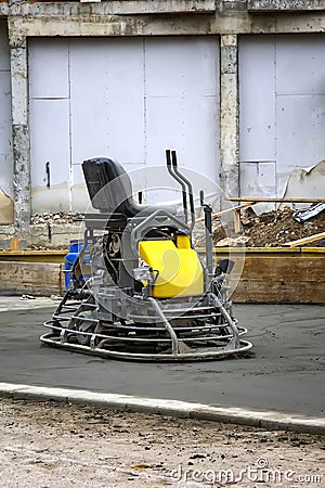 Double power trowel finishing concrete floor smooth concrete surface. Stock Photo