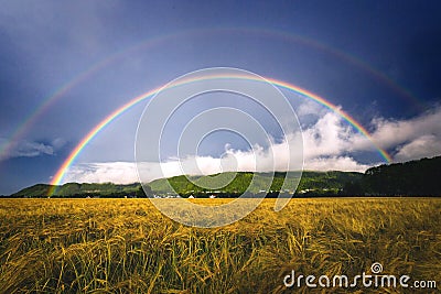 Double rainbow above agricultural fields in rural areas in Ranheim, Norway. Stock Photo