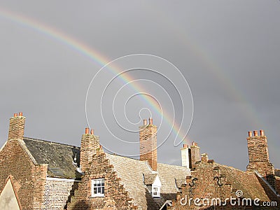 Double Rainbow over old Red Brick Houses Stock Photo