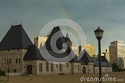 A double rainbow seen during a sunset over the Montreal skyline Editorial Stock Photo