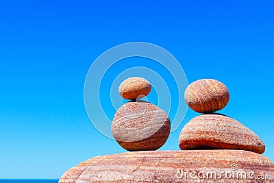 Double red Rock Zen on the background of summer sea. Concept of harmony, balance and meditation. Stock Photo