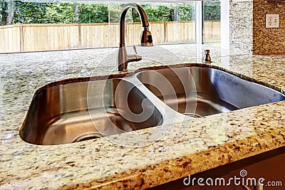 Double steel sink with and granite top. CLose up view Stock Photo