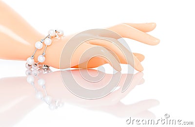 Double strand freshwater pearl bracelet on plastic mannequin female hand. Collection of luxury jewelry accessories. Studio shot Stock Photo