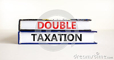 Double taxation symbol. Concept words Double taxation on books on a beautiful white table white background. Business tax and Stock Photo