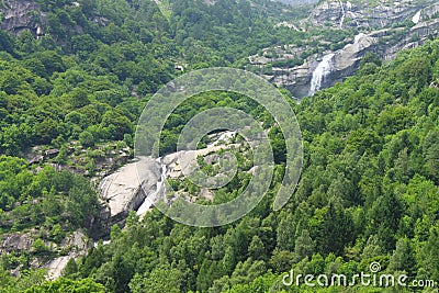The double waterfall in the middle of the trees Stock Photo