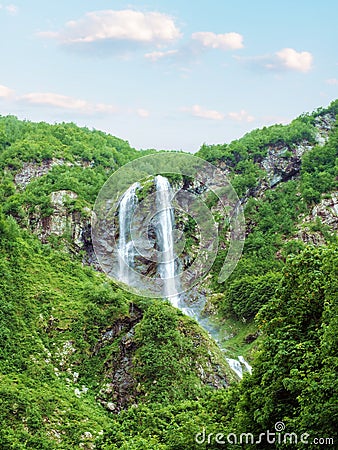 Double waterfall Polikarya in summer rocky mountains, Russia, Sochi. Stock Photo