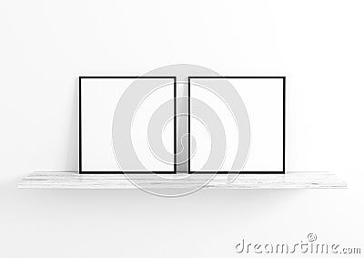 Double 10x10 Square Black Frame mockup on white wooden shelf and white wall. Stock Photo