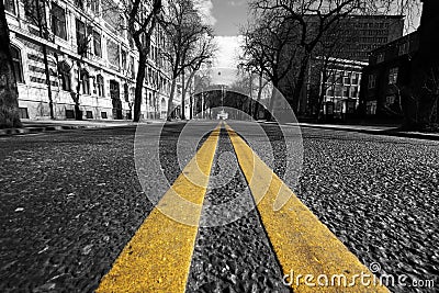 Double yellow lines in city street Stock Photo