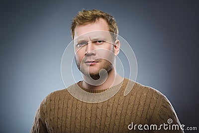 Doubt, expression and people concept - man thinking over gray background Stock Photo