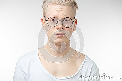 Doubt, expression and people concept - man thinking over gray background Stock Photo