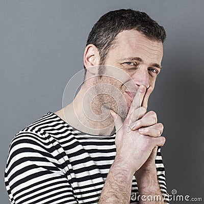 Doubt and regret concept for skeptical 40s man Stock Photo