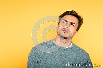 Doubtful dubious hesitant man expression look up Stock Photo