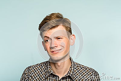 Doubtful man raising eyebrow ironically mockery Stock Photo