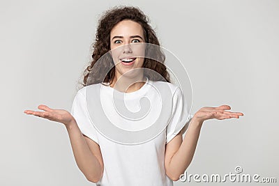 Doubtful uncertain young happy woman cannot make decision. Stock Photo