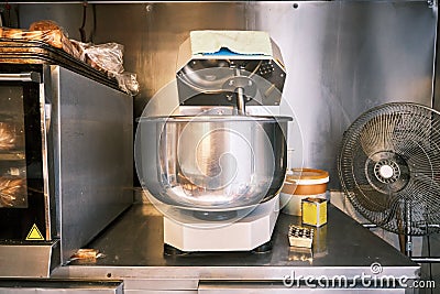 Dough kneader machine in an industrial restaurant kitchen Stock Photo