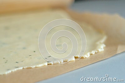 Dough sheet between waxed paper Stock Photo