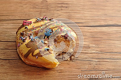 A doughnut with a bite taken out Stock Photo