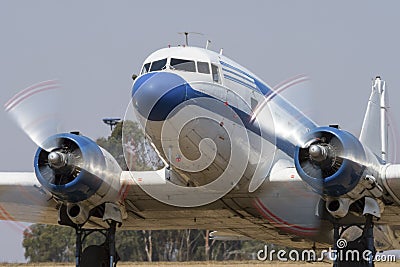 Douglas DC-3 taxiing with prop blur Editorial Stock Photo