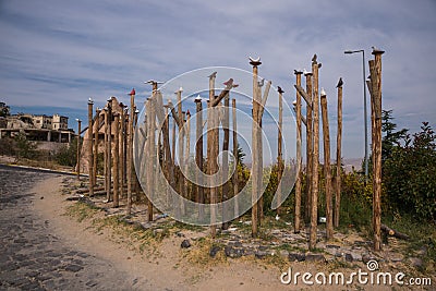 Dove statues on the sticks near entrance to Pigeon valley, beautiful canyon in Cappadocia,Turkey Stock Photo