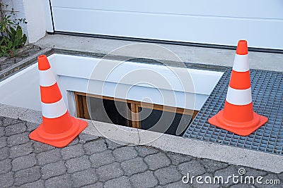 Downfall warning with traffic cones Stock Photo