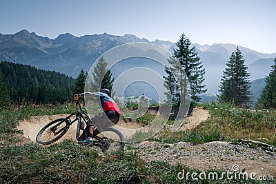 Downhill mountain biking on a shaped bike park trail in Austria Editorial Stock Photo