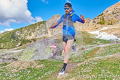 Downhill runner on reported mountain trail_2 Stock Photo