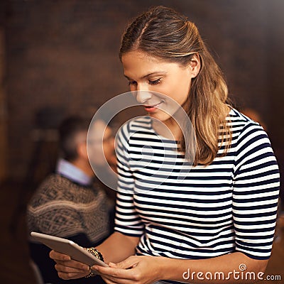 Downloading her presentation. a young businesswoman sitting in the boardroom. Stock Photo