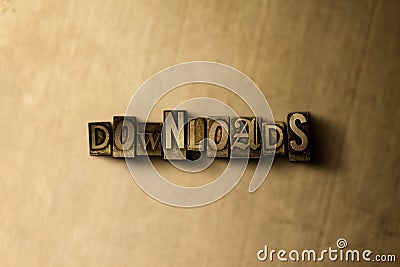 DOWNLOADS - close-up of grungy vintage typeset word on metal backdrop Cartoon Illustration