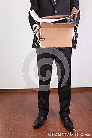 Downsized employee with belongings Stock Photo