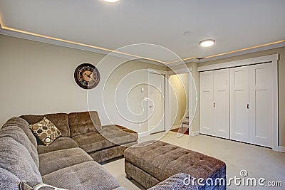 Downstairs Living room with large corner sofa. Stock Photo