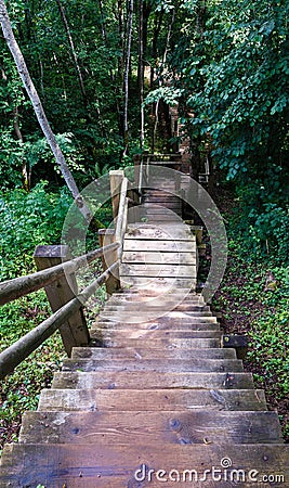 Downstairs steep wooden staircases Stock Photo