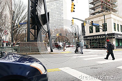 Downtown Atlanta Georgia People crossing the street buildings and traffic Editorial Stock Photo