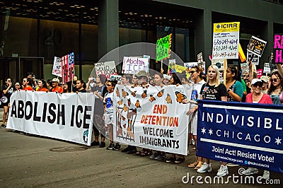 Protest against ICE. Front line marchers with banners supporting immigration Editorial Stock Photo